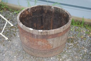 A Half barrel planter, 2' diameter x 16" high.