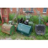 Two cylinder mowers, one with seat and roller, (engine turns) the other (as found).