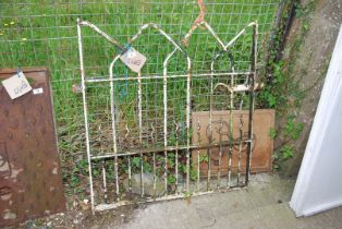 A metal garden gate, 34" wide x 37" high.