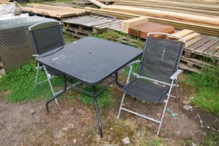 A Patio table, 34" square x 28" high and two chairs.