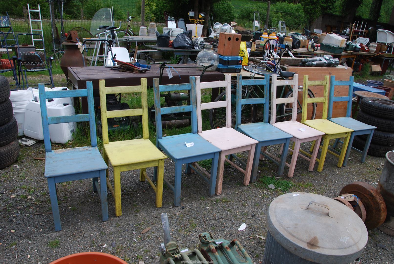 Eight painted kitchen chairs.