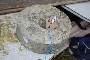 A Wet stone, 13" diameter x 3 1/2" thick.