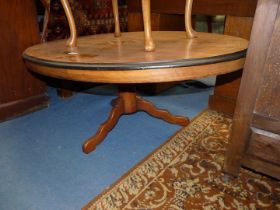 A Satinwood oval occasional Table standing on a turned pillar and three shaped feet,