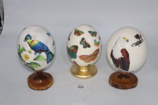Three "Sherry Rowe" signed Ostrich Eggs, circa 1970/80's and having scenes depicting Fish & eagle,