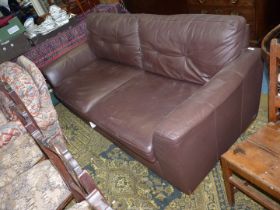 A brown leather Settee.