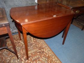 An oval Mahogany dropleaf Pembroke type Table standing on tapering square legs and having boxwood