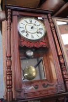 An Attractive Edwardian drop dial, eight Day wall Clock, striking on a bell, with painted dial.