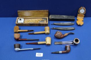A small quantity of miscellanea including a boxed writing set, a pair of cased cut-throat razors,