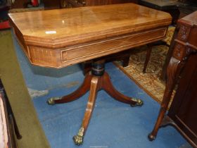An excellent quality Rosewood and other woods flap over Card Table standing on a turned pillar with