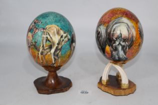 Two "Sherry Rowe" signed hand painted Ostrich Eggs circa 1970/80's, depicting African animals,