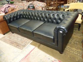 A contemporary buttoned back, black upholstered three seater Chesterfield type Settee,