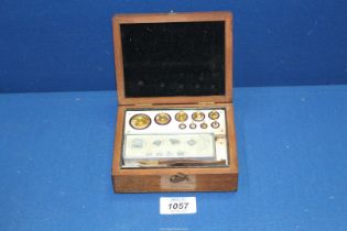 A set of Apothecary/jewelers Weights (some small milligrams tabs missing).
