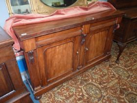 A delightfully plain Mahogany Sideboard having a pair of frieze drawers and a pair of arched