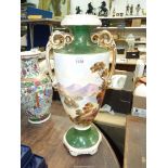 A very large vintage Vase with handles having mountain and tree pattern, 19" tall.