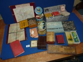 A quantity of old games and wooden jigsaws, playing cards, etc.