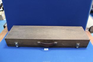 A shotgun carrying Case, 32'' long.