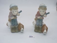 Two Lladro figures of the Hunter boy with dog.