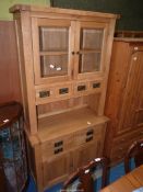 A light modern Oak Dresser with glazed cupboard, with spice drawers under,