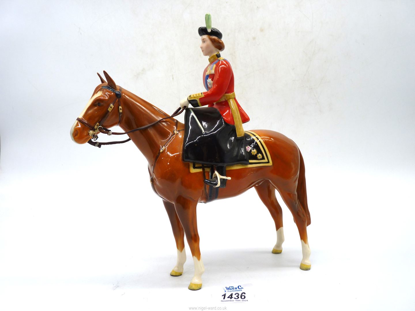 A Beswick figure of HM Queen Elizabeth II mounted on horse Trooping the Colour 1957.