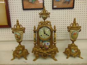A gilt clock garniture set,