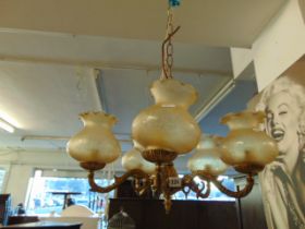 A brass five tier ceiling light