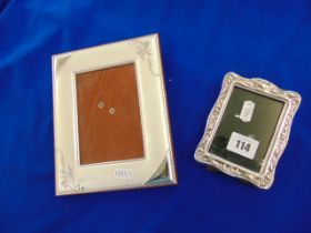 A hallmarked photo frame plus another poss silver