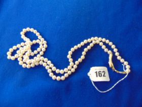 A Pearl necklace with Artdeco Snake clasp set with centre garnet