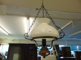 A wrought iron and glass hanging lamp
