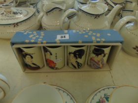 Four boxed Japanese cups