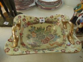 A decorative two handled dish