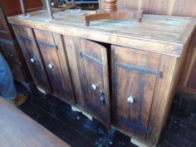 An Indian Teak four door cupboard