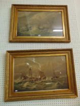 A pair of gilt framed etchings,
