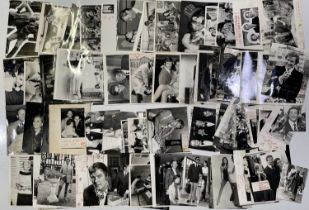 ROGER MOORE - LARGE COLLECTION OF PRESS PHOTOGRAPHS.