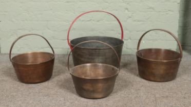 Four jam pans, of varying size. Largest - Height: 45cm Diameter: 42cm. Largest example has two drill