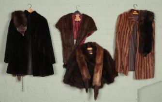 A collection of real and faux fur coats, capes and stoles. Includes silver fox stole example, etc.