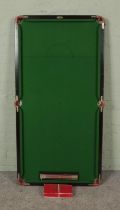 An Ambassador table top snooker table with score board and balls. 79x154cm.