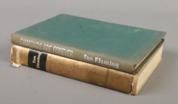 Two Ian Fleming James Bond books. Goldfinger, published by Jonathan Cape and issued by The Book