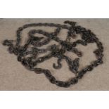 A quantity of large thick cast iron chains