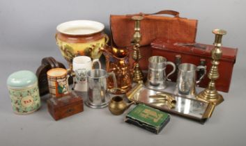 A box of mixed collectables including brass candle sticks, pewter tankards, ceramic jardiniÃ¨re,