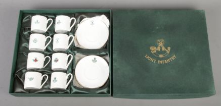 A boxed Impamark Ltd made 'Light Infantry' presentation Fine Bone China tea service. Containing