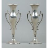 A pair of Art Nouveau style twin handled weighted bud vases, with circular base. Assayed Birmingham,