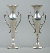 A pair of Art Nouveau style twin handled weighted bud vases, with circular base. Assayed Birmingham,