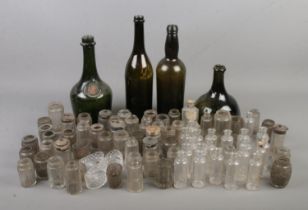 A large collection of vintage bottles