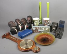 An assorted mix of collectable items including two glass vases, carnival glass plate, boxed