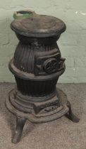 A cast iron pot belly stove. (63cm)