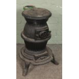 A cast iron pot belly stove. (63cm)