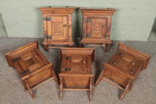 Five small antique style pine wall mounting cabinets.