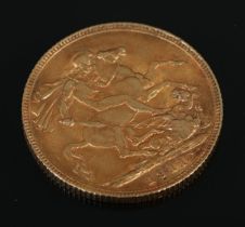 A 1911 George V gold sovereign.