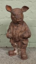 A rusted cast iron garden ornament of 'Mr. Pig', in the same style as a Wind in the Willows