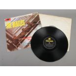 The Beatles Please Please Me vinyl LP record. Mono (PMC 1202) Fourth Pressing, matrix number XEX-